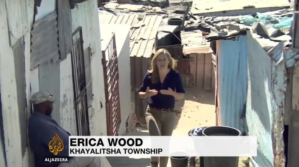Erica Wood reporting from Khayalitsha Township for Al Jazeera, covering community and human-interest stories.