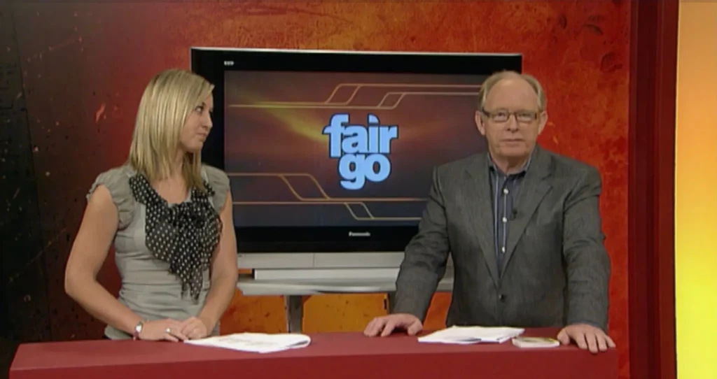 Erica Wood presenting on the Fair Go TV programme set, showcasing early broadcast journalism experience.