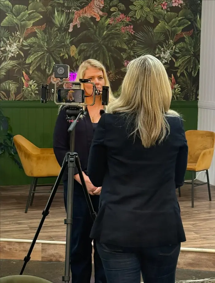 Erica Wood coaching a participant in an on-camera media training session, as part of her media cut-through workshop.