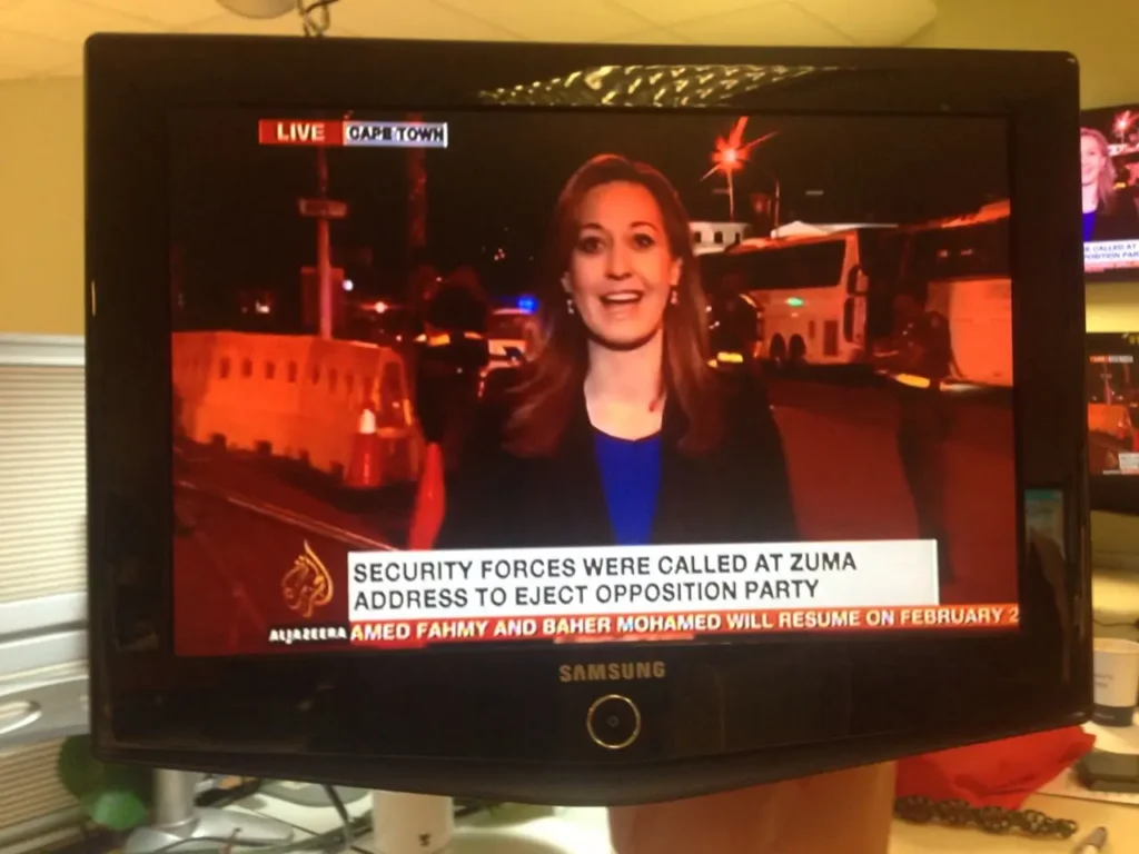 News presenter on screen during a live broadcast, symbolising strategic media targeting and effective campaign storytelling